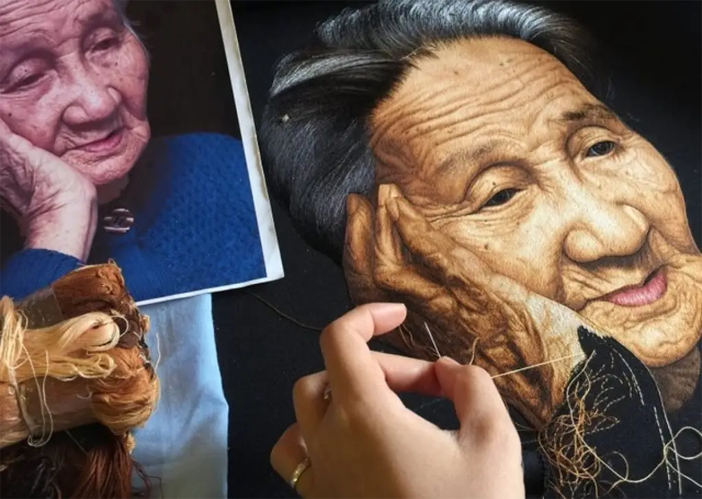 Artist creating traditional Vietnamese thread art piece