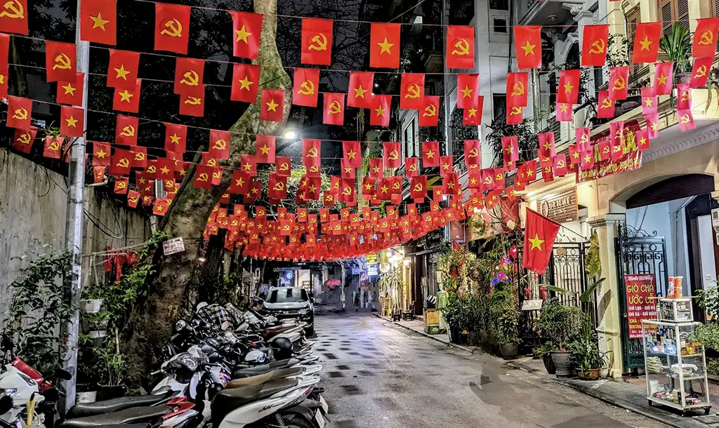 Flags flying on Au Trieu Street in Hanoi's Old Quarter