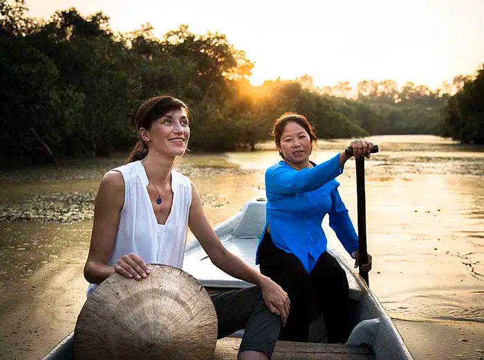 Cruising by sampan on the Mekong river in Vietnam