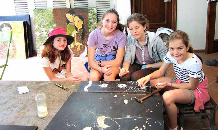 Children learning lacquer in Hanoi, Vietnam