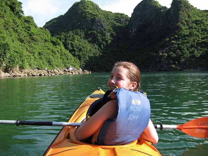 Teen kayaking on Halong Bay, Vietnam