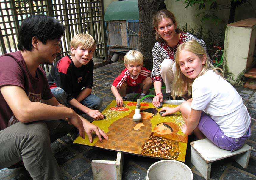 Children learning how to create lacquer in Hanoi