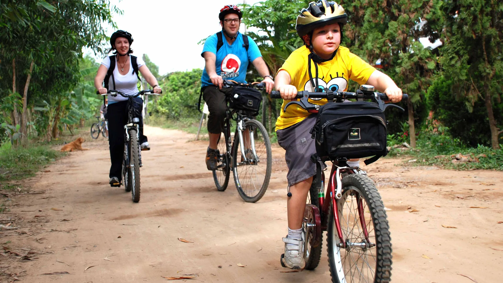 Family cycling through the Mekong Delta countryside in Vietnam